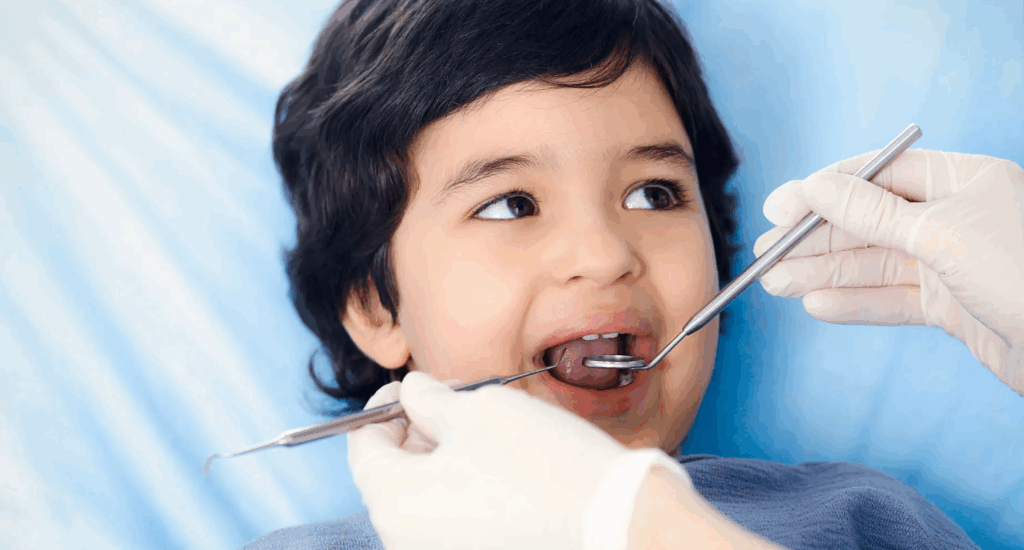 Happy child having a fun and stress-free visit with a child dentist at The Dental Clinic